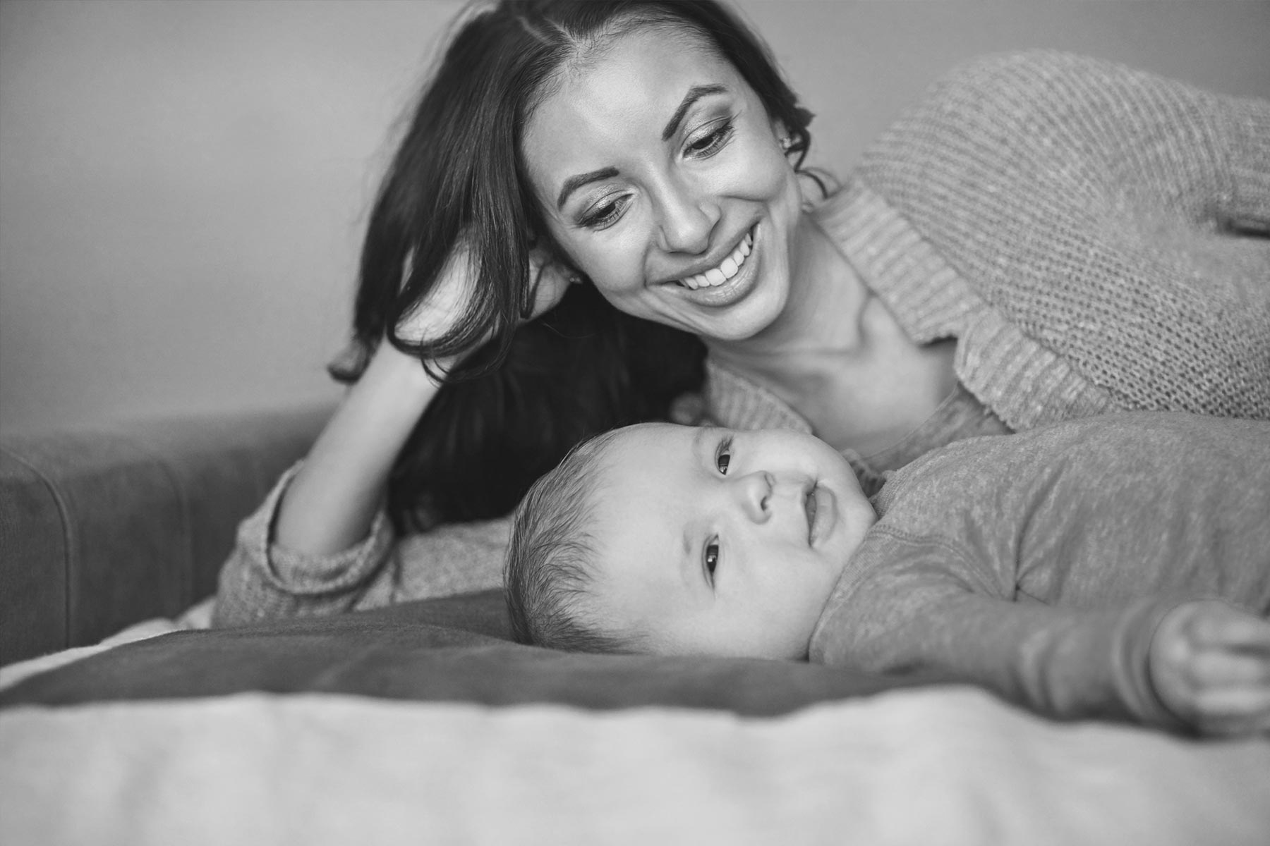 Happy mother smiling over son